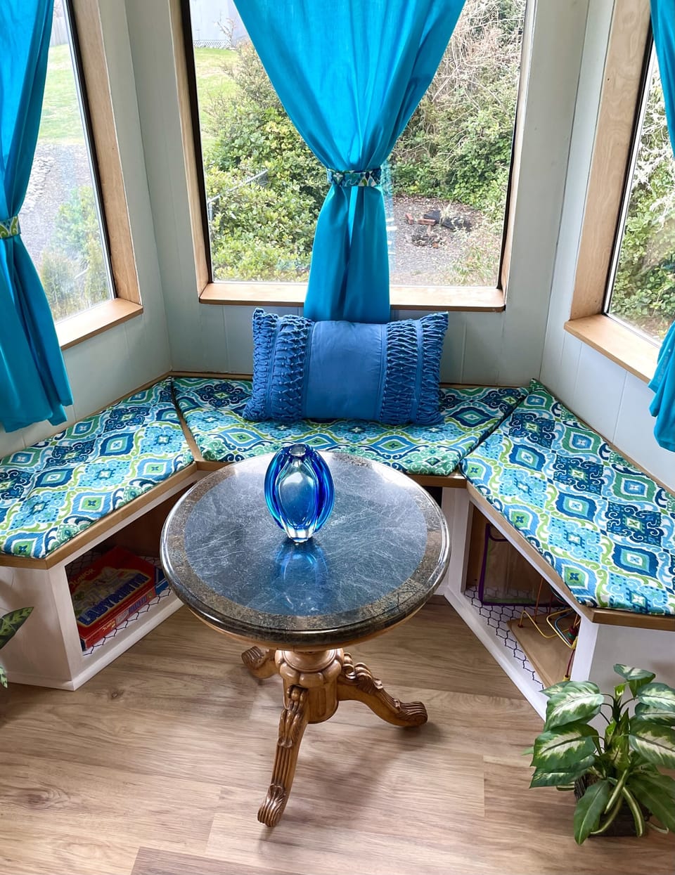 Sitting nook with view of mountains and river.