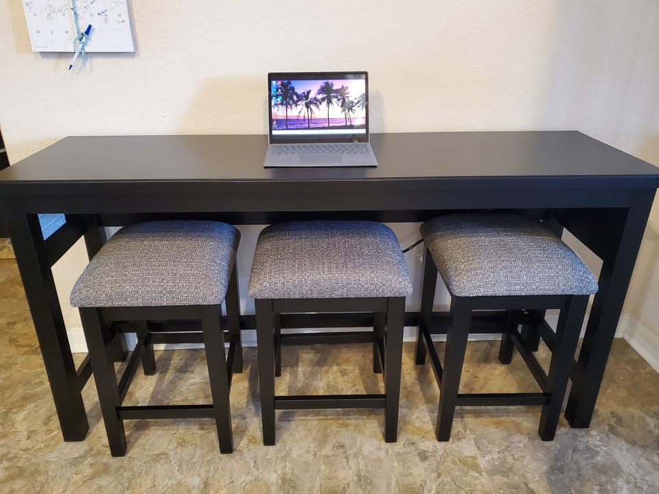 Side table with stools and charging station