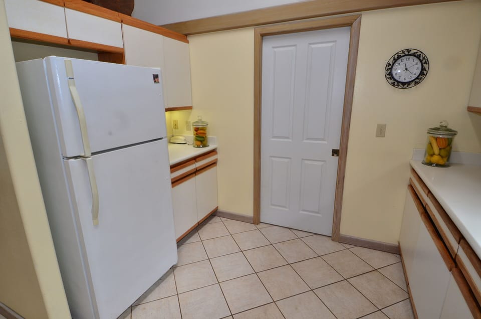 Kitchen with separate laundry room.