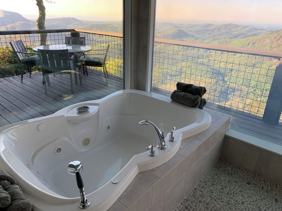 Soak in a 2-person jacuzzi spa with infinite mountain views!!