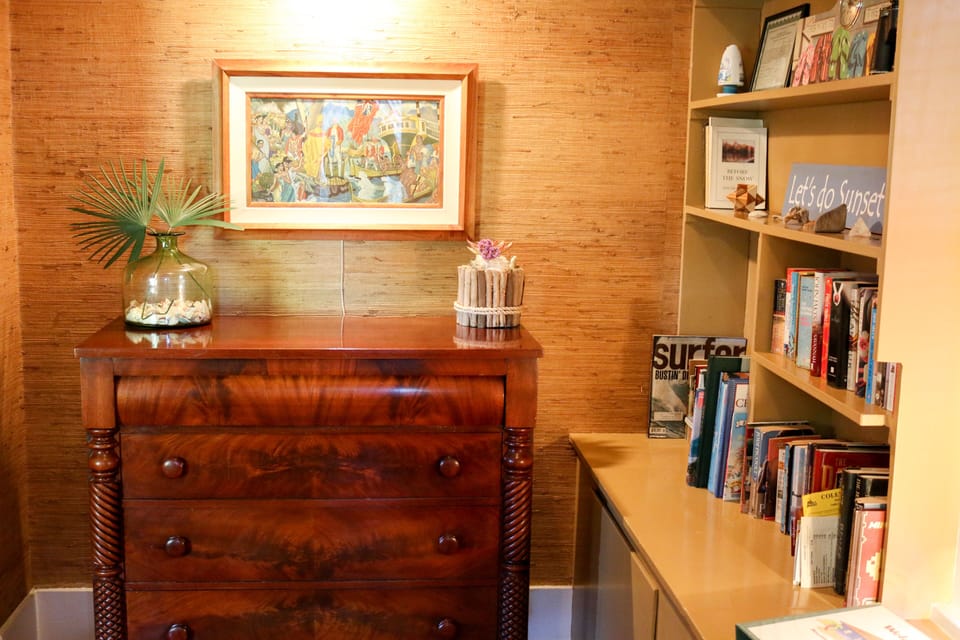 Entryway and shelves filled with games, books, and more games.