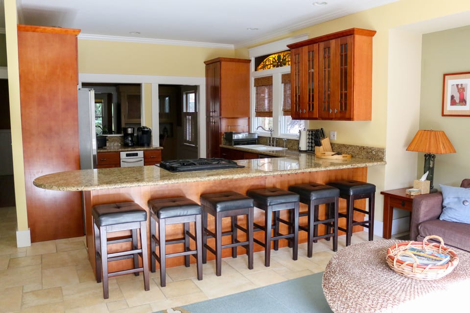 Kitchen and peninsula, which seats 6. Great for gathering around while cooking.