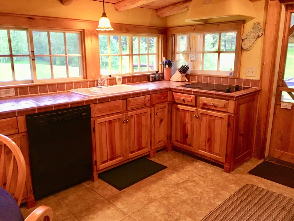 Cozy kitchen with view of private meadow
