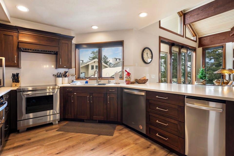 Gourmet kitchen with handcrafted wood cabinets and mountain charm.