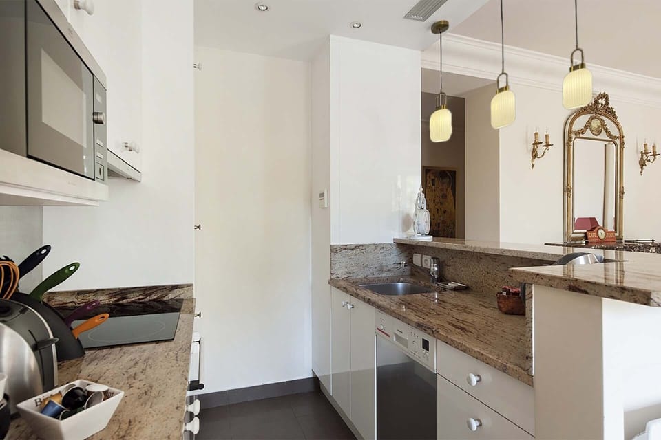 All necessary appliances are at your disposal in this modern kitchen.