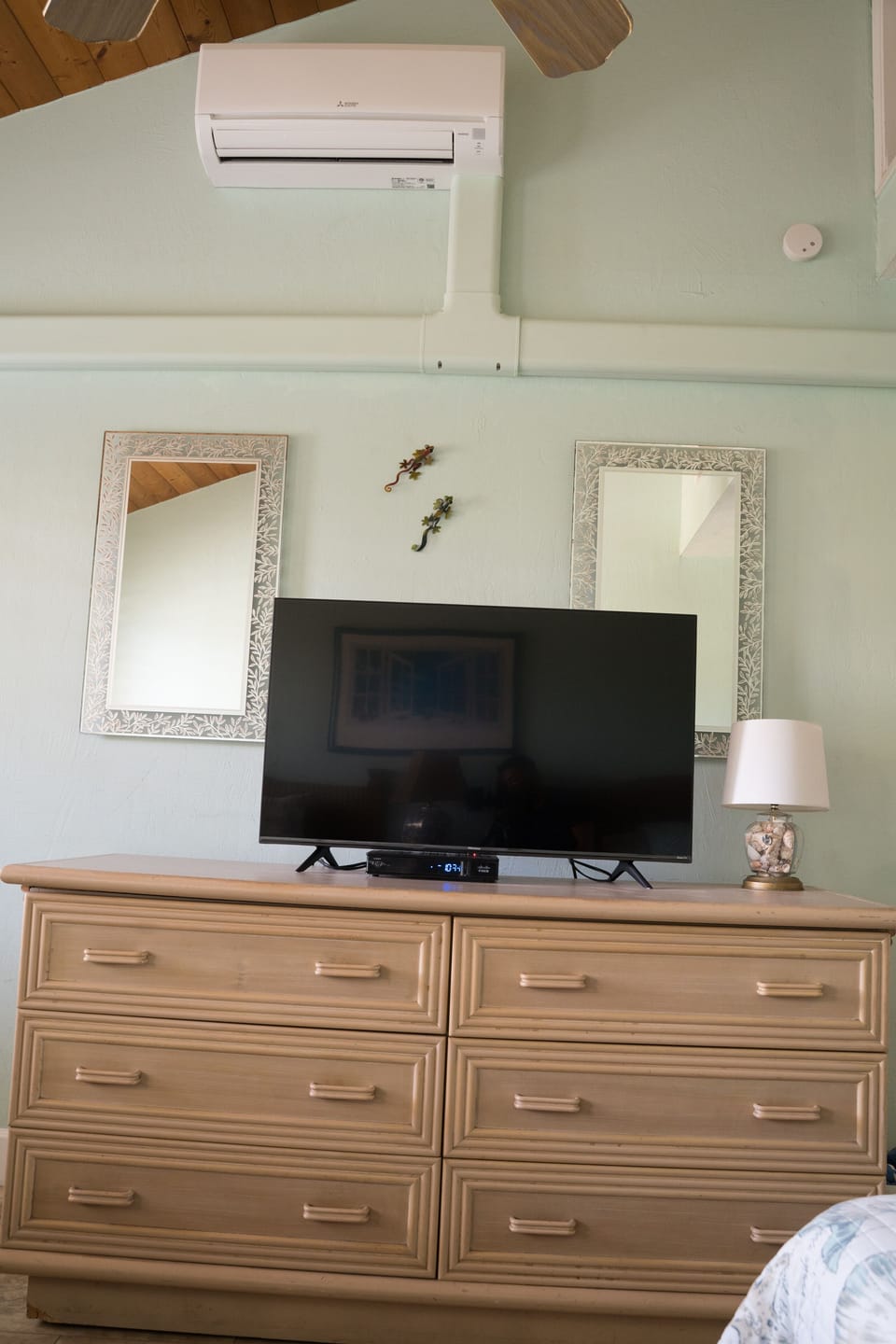 Guest bedroom with smart TV and split AC