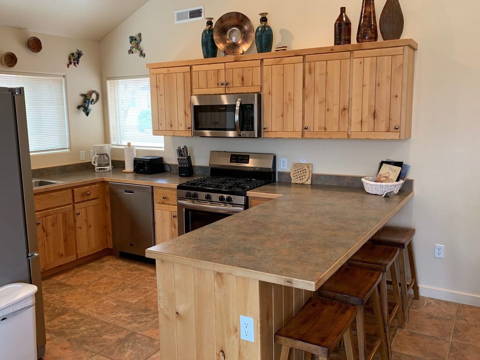 Fully equipped kitchen - place settings, cookware, silverware, baking dishes
