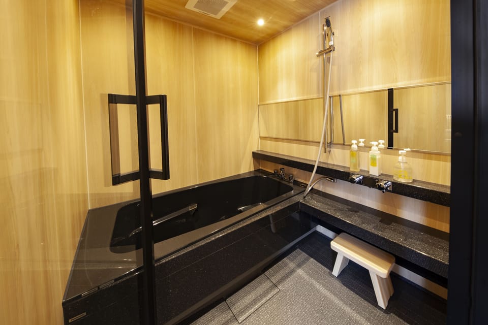Combined shower/tub, free toiletries, hair dryer, slippers