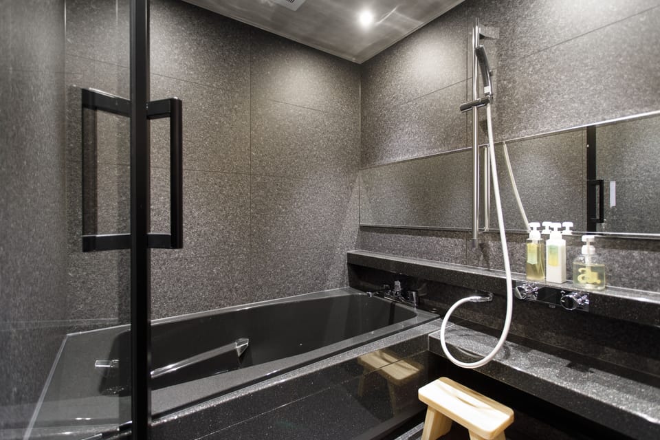 Combined shower/tub, free toiletries, hair dryer, slippers