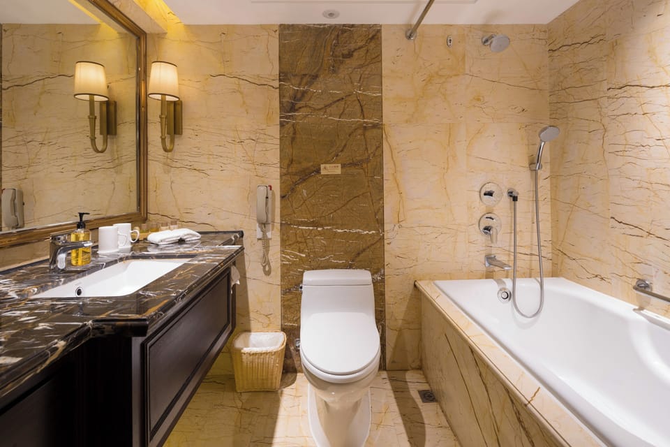 Combined shower/tub, designer toiletries, hair dryer, bathrobes