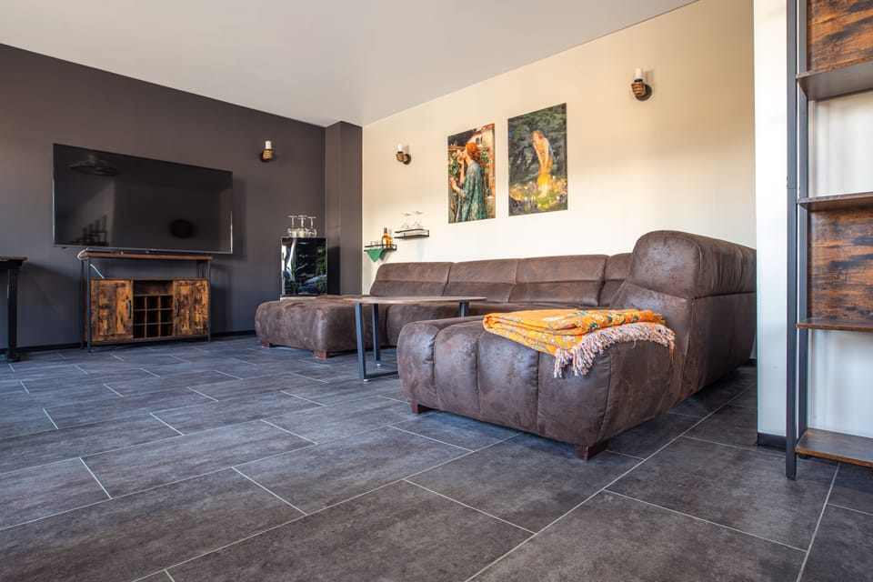 Luxury Double Room, 1 King Bed, Terrace, Courtyard View | Living area | TV, books
