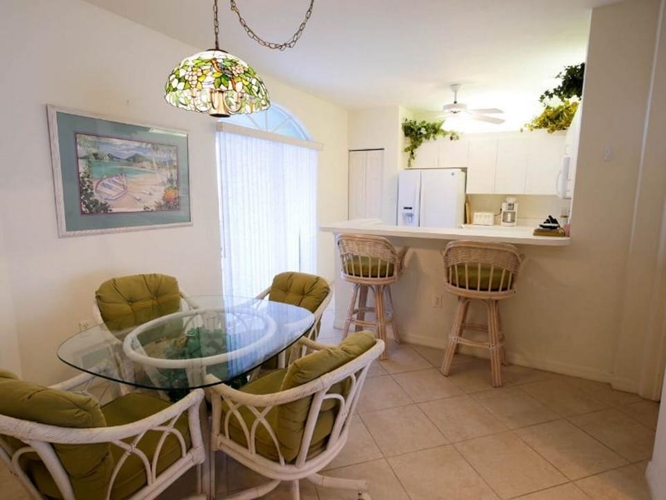 Outdated Picture of Kitchen and appliances, Tables and Chairs still there