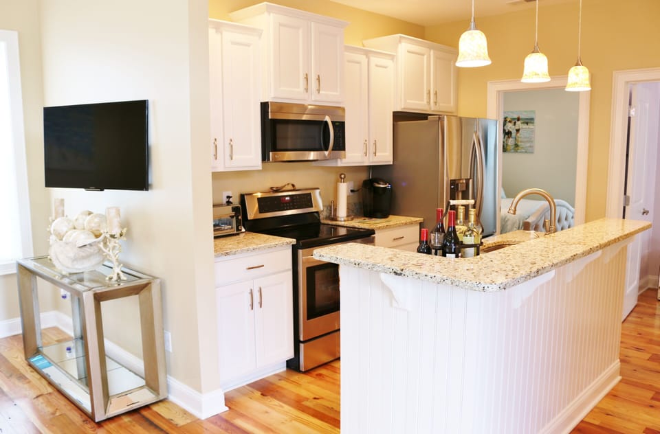 Beautiful Kitchen with Stainless Steel Appliances and All Cooking Utensils, etc