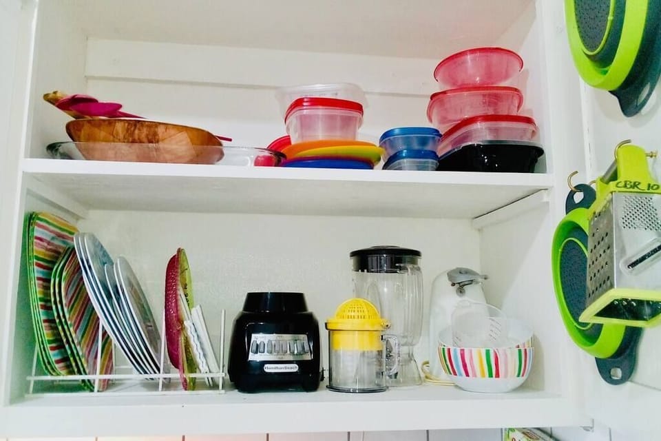 Blender, electric can opener, salad bowls, colanders and other supplies.