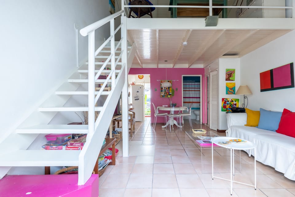Living and dining areas. The stairs take you to the bedroom loft.