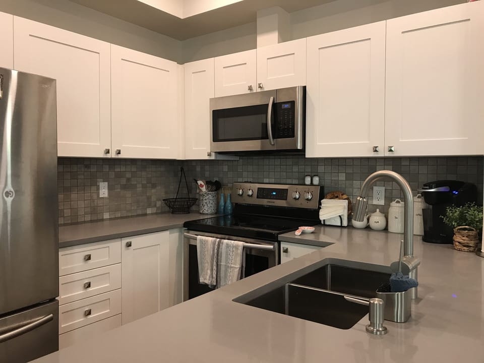Bright, clean, well stocked kitchen.