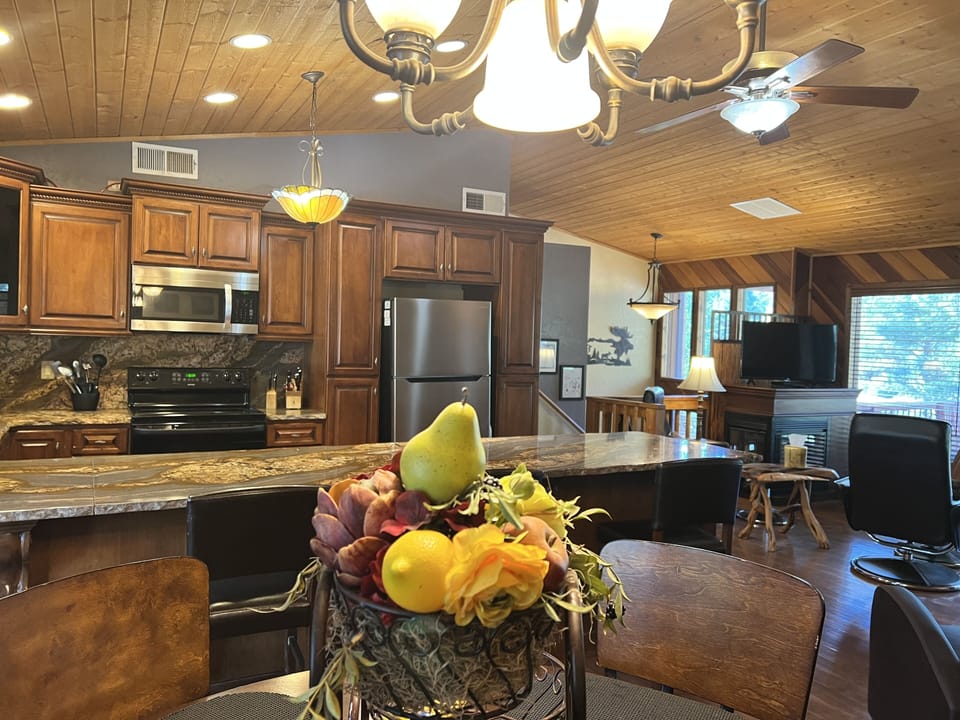 Kitchen dining area, table has 6 chairs plus counter has 4 chairs