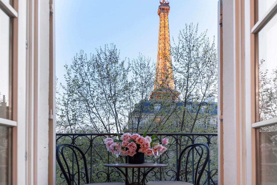 Watch the Eiffel Tower light up the winter sky at sunset.