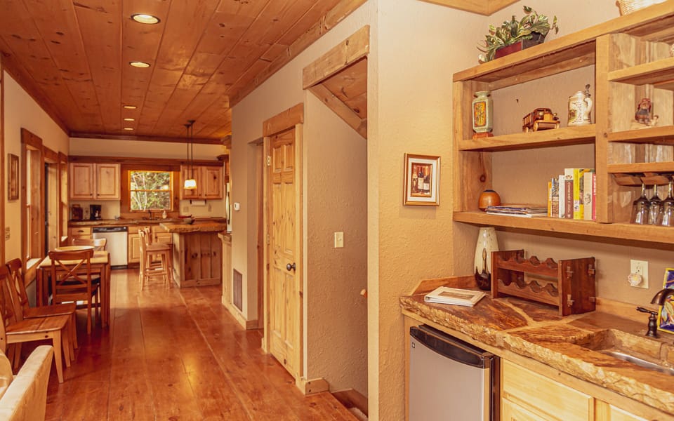 Open living area, kitchen and wet bar 