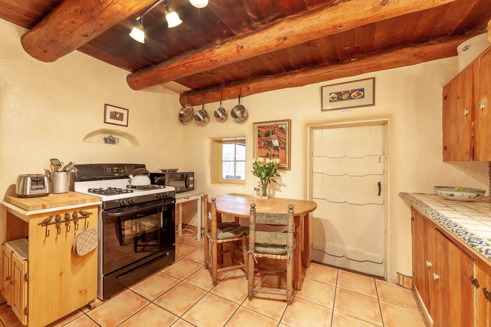 Mexican tile in the kitchen and a cozy spot to have breakfast. 
