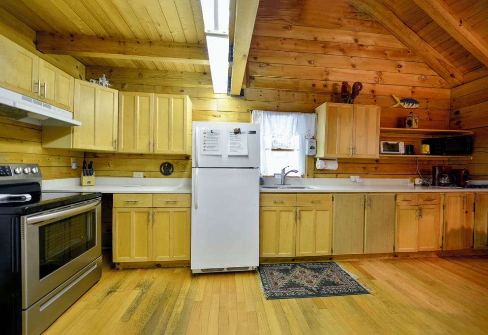 Full kitchen with Stove, Oven, Refrigerator, Toaster Oven, and Coffee Machine 