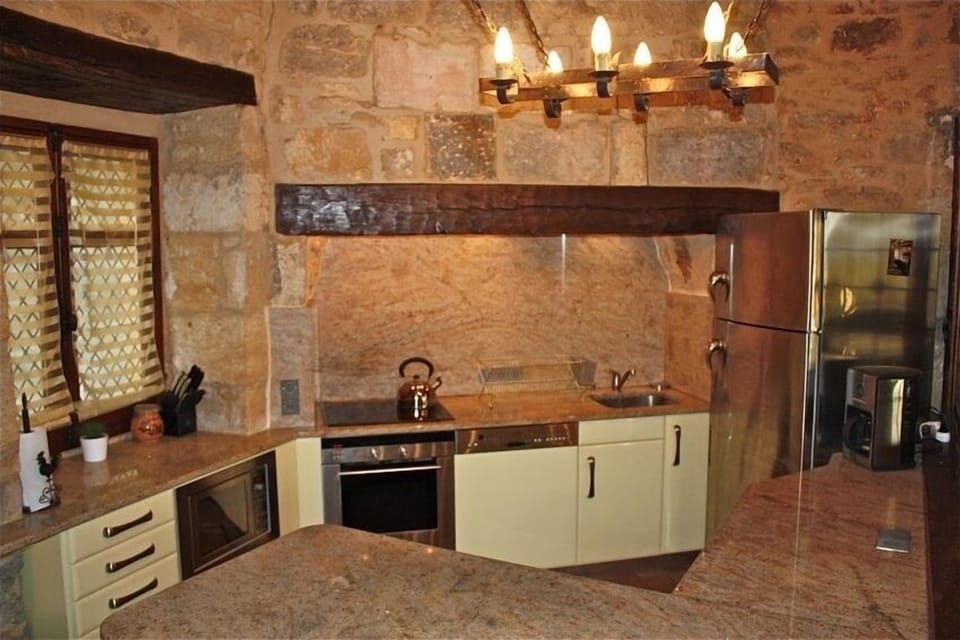 Fully Equipped Kitchen with high-end appliances and granite countertops