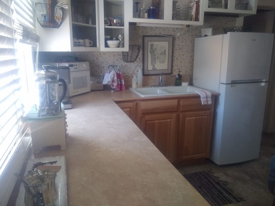 An efficient and well stocked kitchen awaits.  