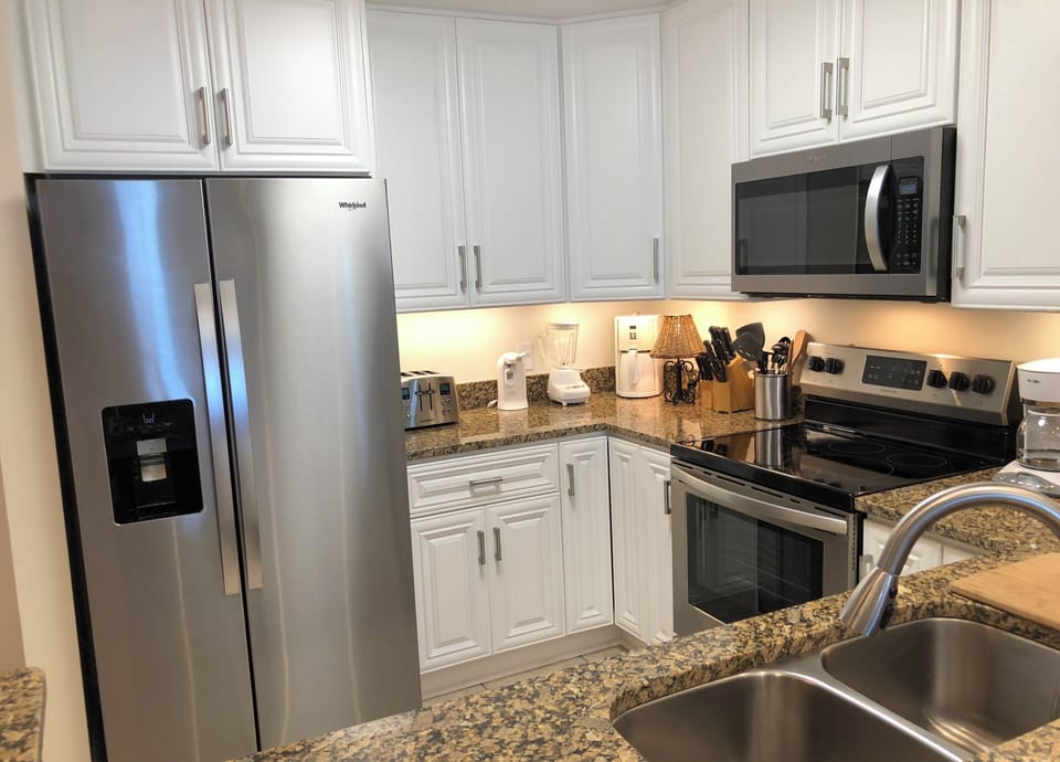 Open kitchen - stainless steel refrigerator with water/ice in the door
