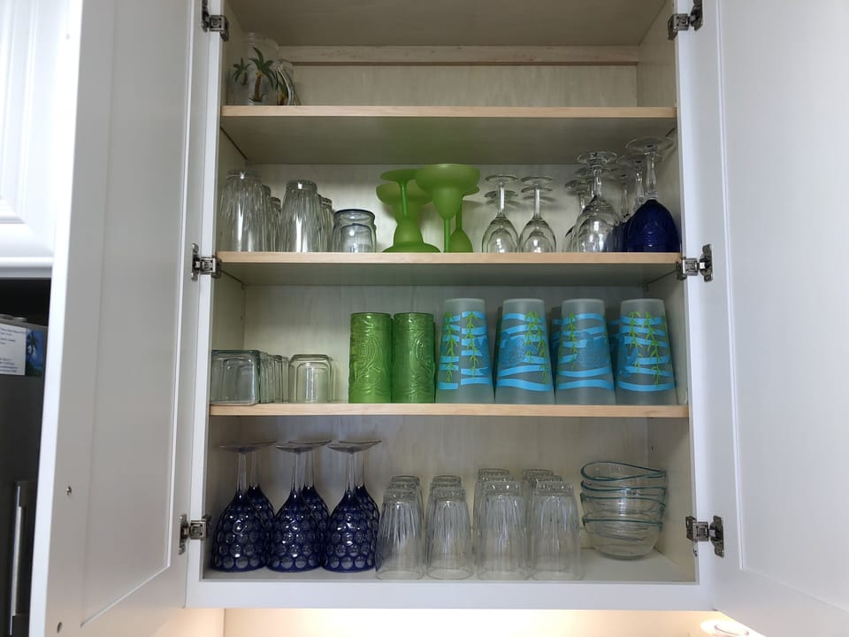 Fully stocked dishes with glasses for all types of drinks 
