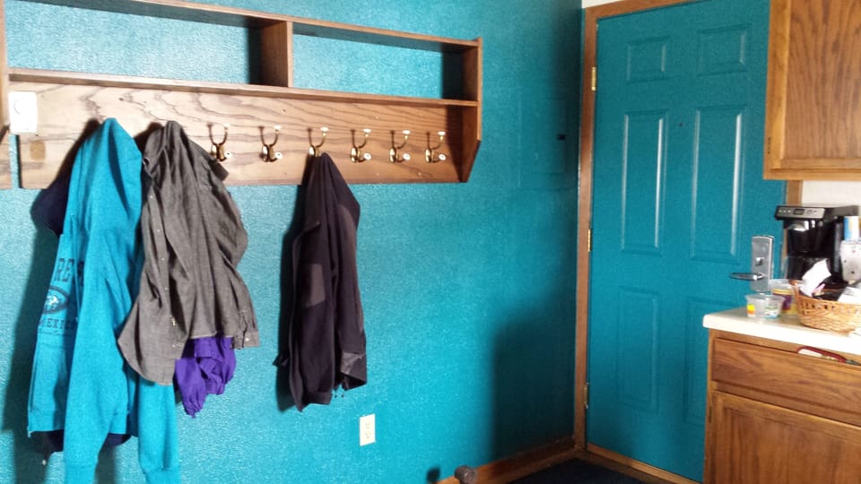lots of hooks and shelves for outdoor things