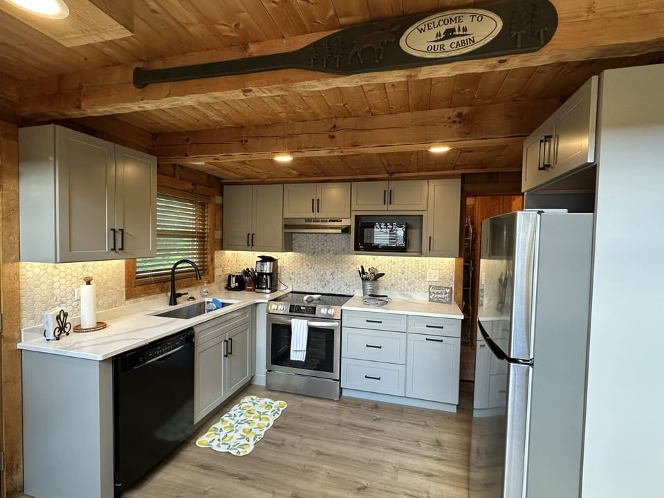 Newly remodeled kitchen with new cabinets, appliances, and quartz counter tops