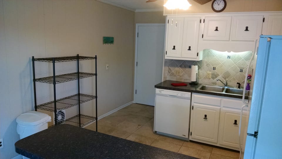 Shelf for food keeps counters uncluttered   