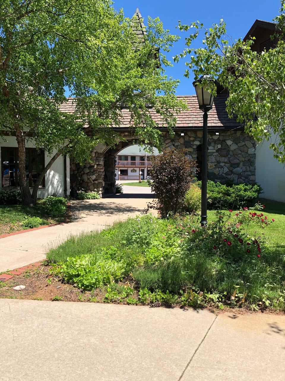The archway between front circle drive at the lodge and the patio/pool and Ivans