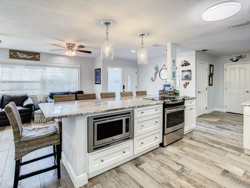 View of large eating are with seating for 6. All appliances are fairly new.