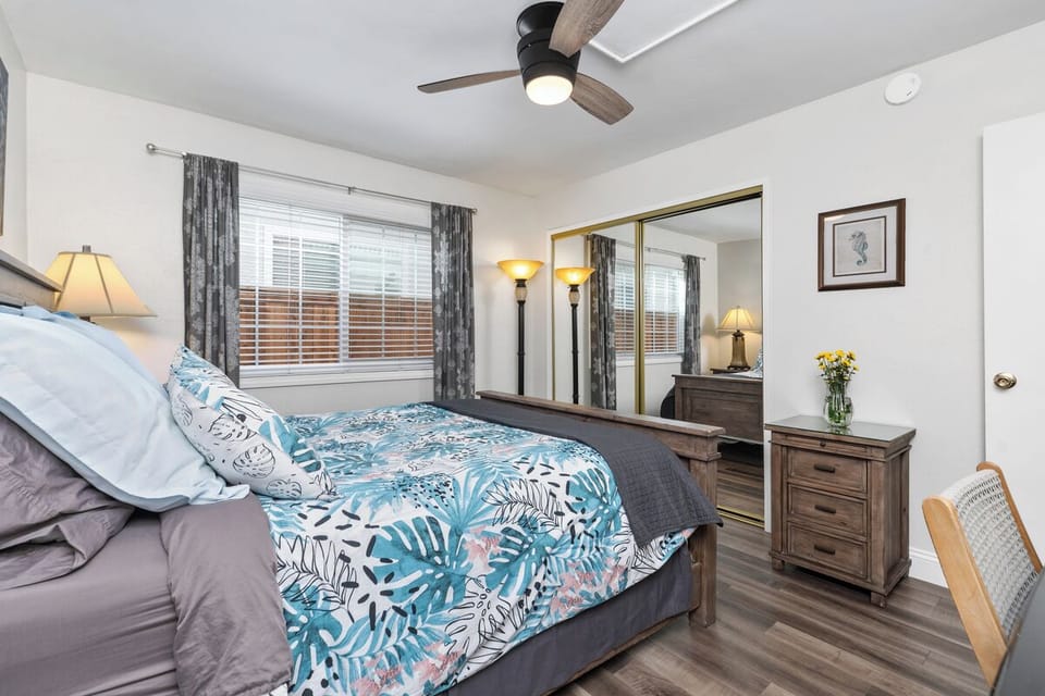 Guest bedroom with mirrored closet doors