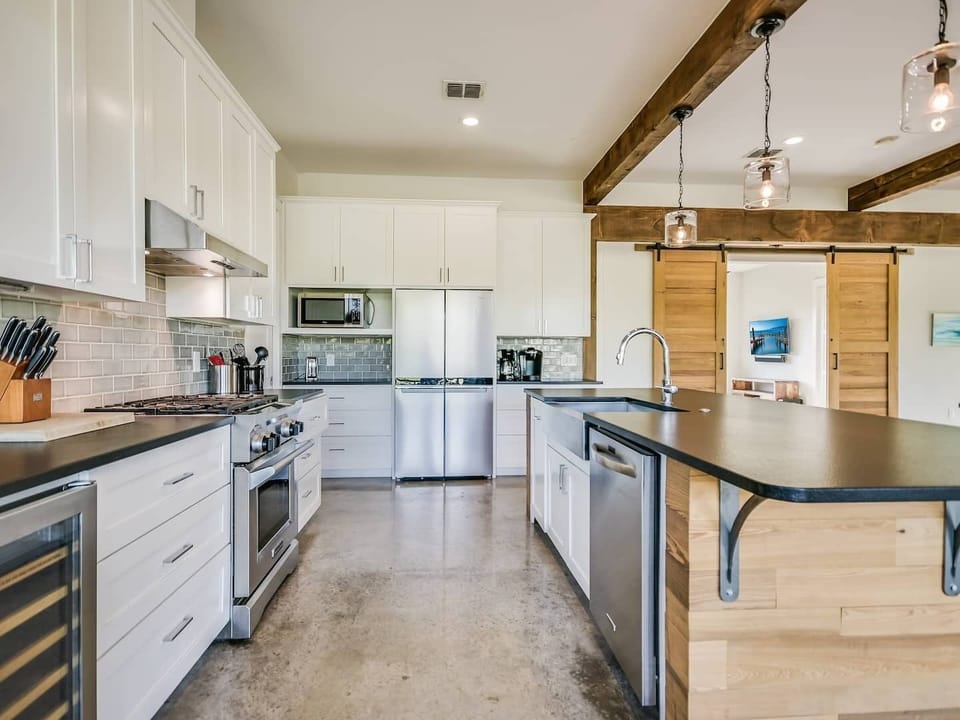 Another view of kitchen.  Sliding barn doors to the right lead to the "bonus room".