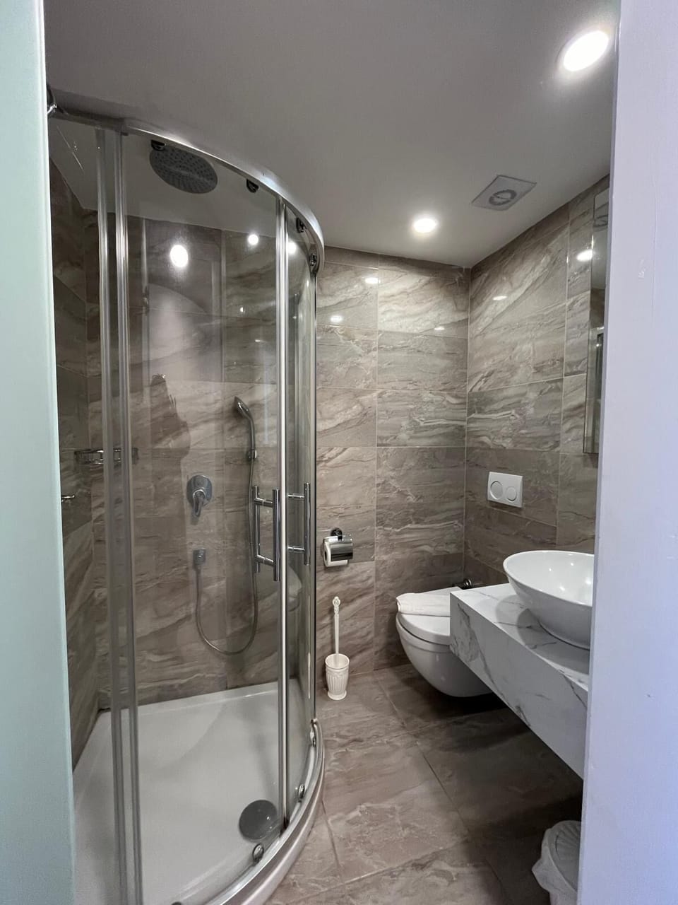 Shower, free toiletries, hair dryer, slippers