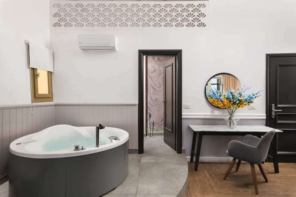 Suite, 1 Bedroom, Hot Tub, Sea View | In-room safe, desk, soundproofing, iron/ironing board
