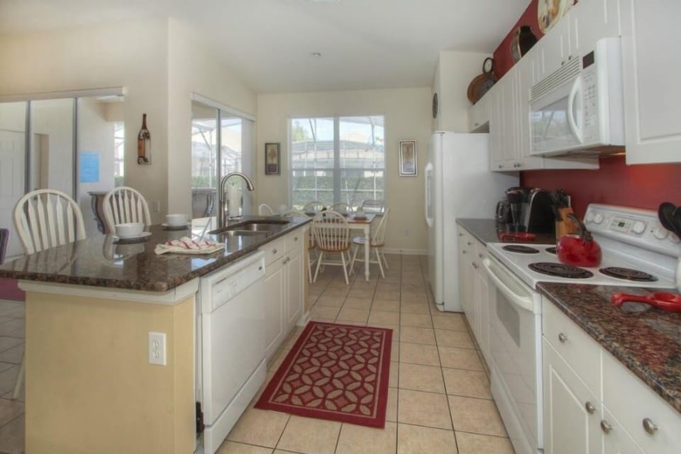 Kitchen with Island prep area and sink.