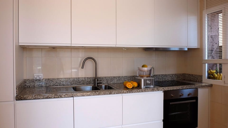 Dishwasher, oven, electric hob, coffee machine, kettle, fridge and freezer.