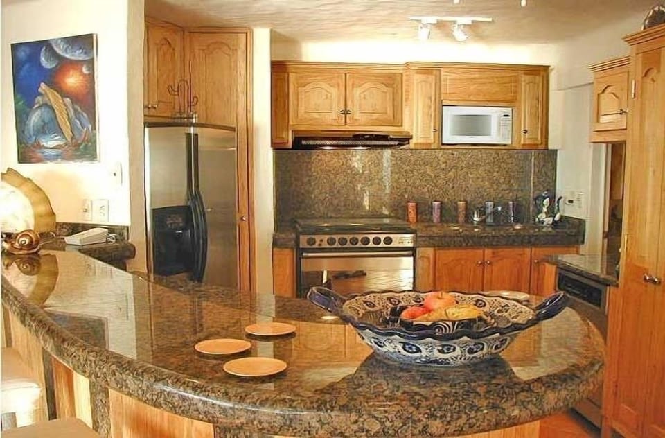 Hand Hewn Granite Graces The Custom Designed Kitchen.