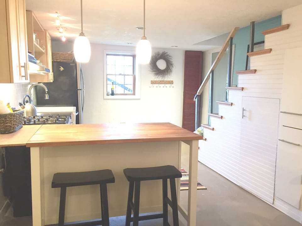 kitchen  -great to hang out, sunroom on right, stairs up to bedrooms and foyer.