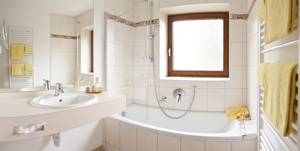 Suite, 1 Bedroom, Balcony | Bathroom | Hair dryer, bathrobes, slippers, towels