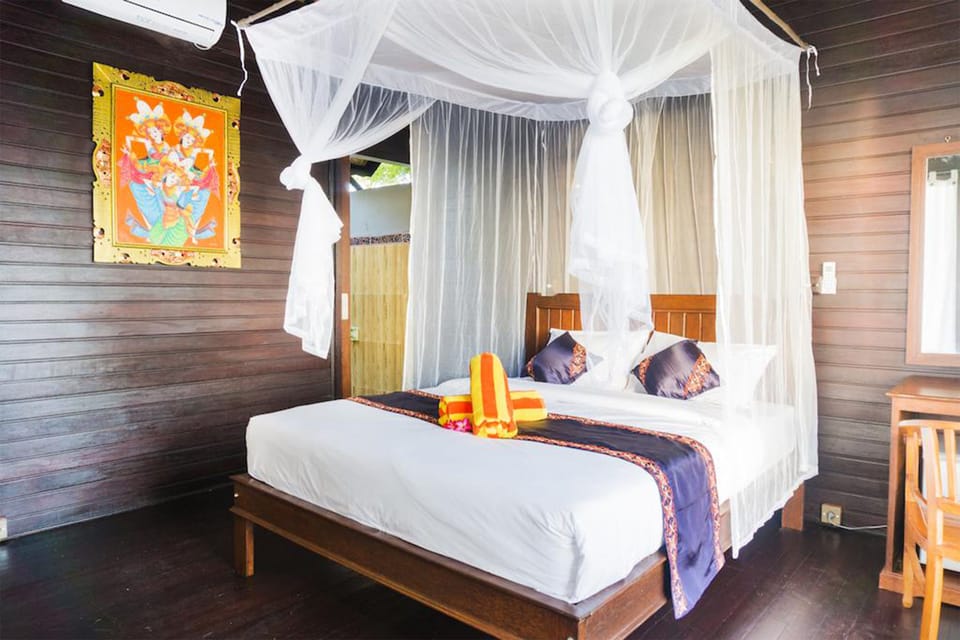 Deluxe Bungalow, Sea View | Minibar, in-room safe, desk, soundproofing