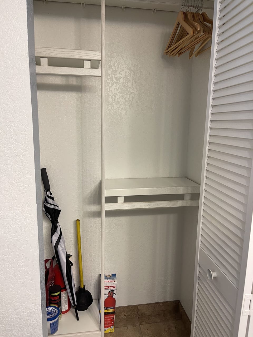 Closet with Umbrella & 2 Robes.