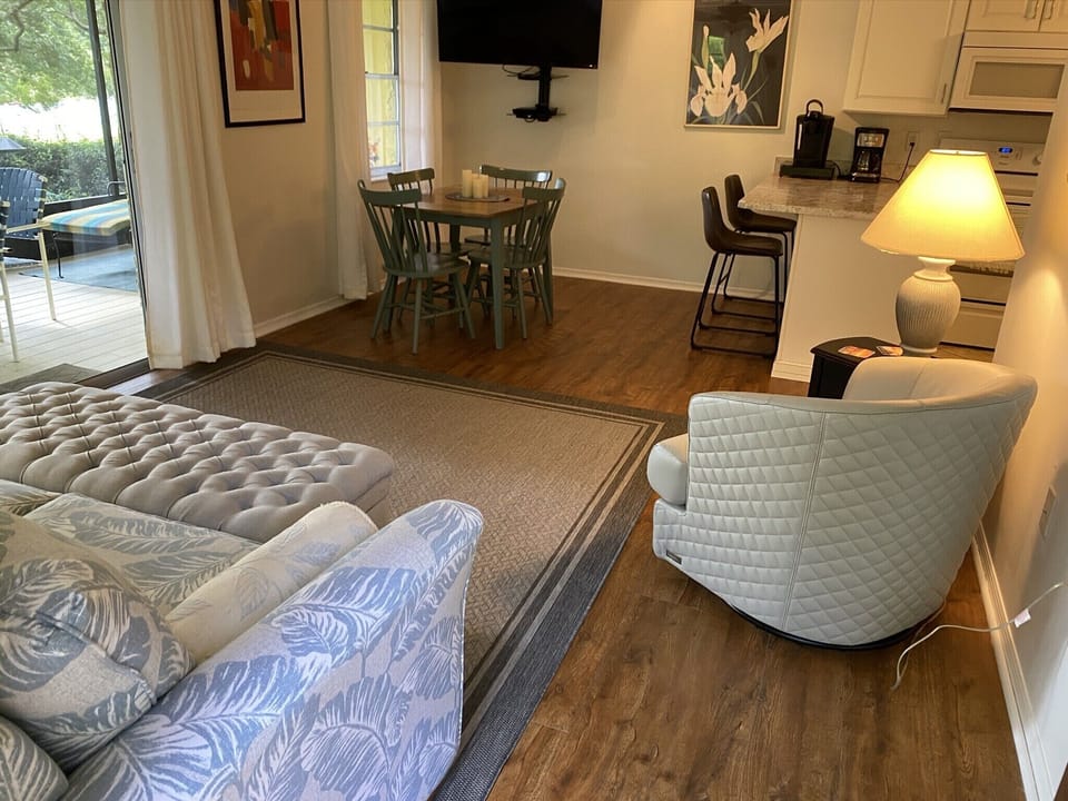 View when you walk in the door of the living area, dining area and back porch.