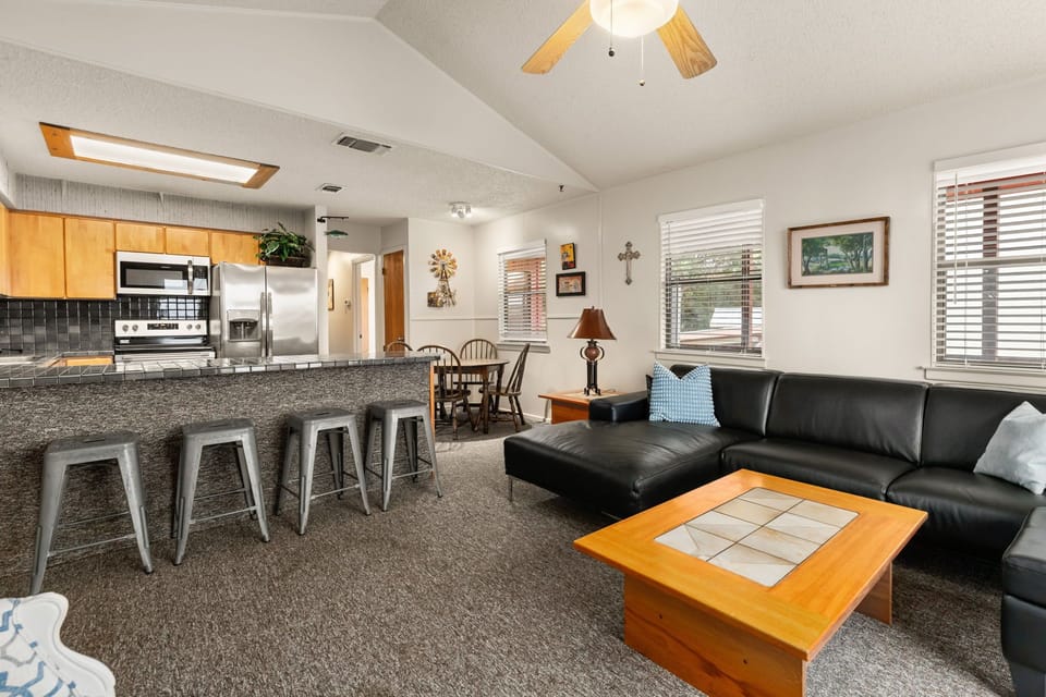 Open floor plan with living room, dining area, and kitchen.