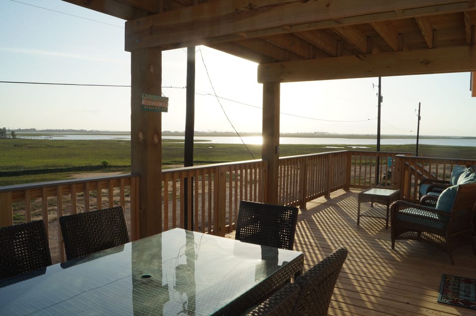 Bottom deck with amazing views, a table for a family dinner outside