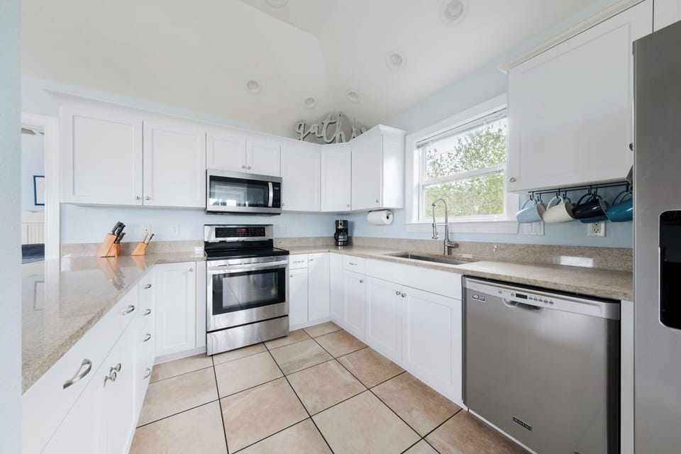 Serve a crowd with granite countertops, deep sink & stainless steel appliances.