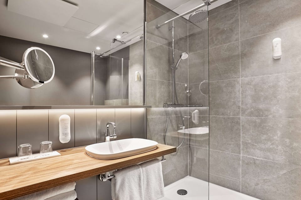 Shower, eco-friendly toiletries, hair dryer, towels